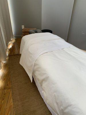 Comfy massage table and relaxing room