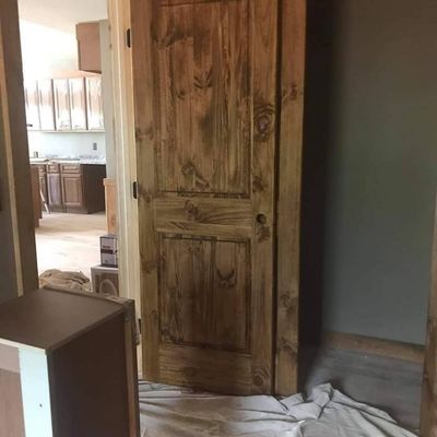 Freshly stained door by J&M Painting LLC