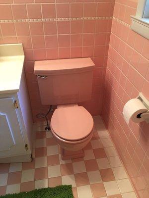 Vintage pink toilet we installed in our pink bathroom. Parts from Locke were used to refurbish this.