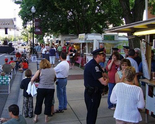 Residents attending the Lancaster Festival with the downtown stage in the background