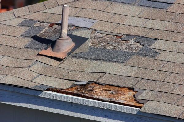 Wind damage to an Asphalt Roof.