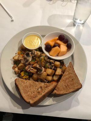 Salmon hash with mushrooms and a side hollandaise