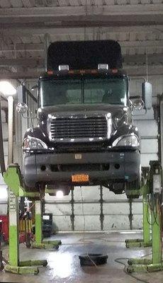 Heavy duty truck on a lift for service