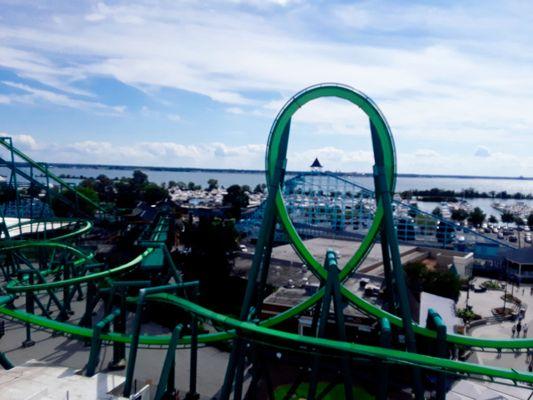 The 78ft lift hill (and famous cupola) for 'Blue Streak' are visible through the center of the 1st loop on CP's resident invert 'Raptor'