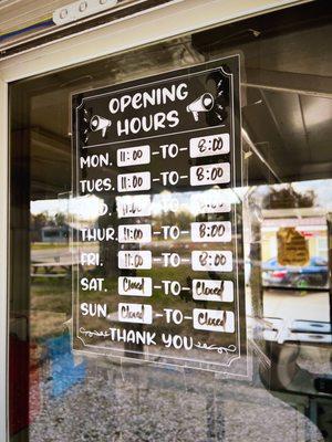 Opening Hours sign