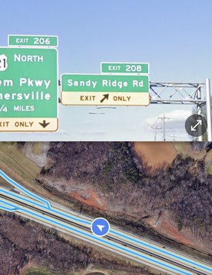 I-40 Heading West - Sandy Ridge Road Exit 208 and then turn Right and Right again at Triad Road into the Sheetz parking lot