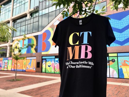 The new Charm'tastic Mile "CTMB" Ladies Souvenir-Fashion T-Shirt in Our Baltimore Mural Theme Colors.