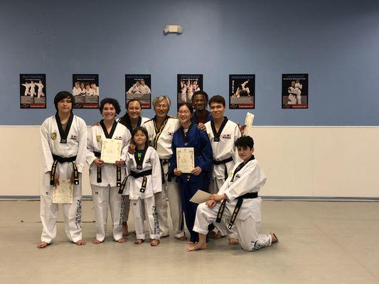 Our new students of black belt class getting their new belt and certificate. Good job everyone