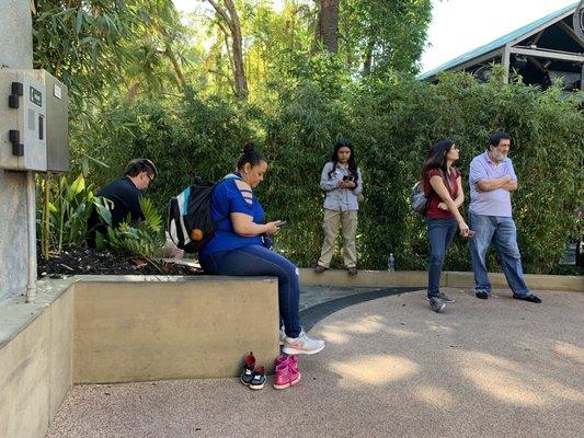 Parents staking out the exit so their kids don't wander free into the park.