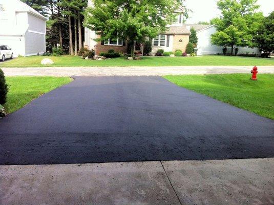 Our new driveway before it was damaged and "repaired." Now look at our patched driveway!