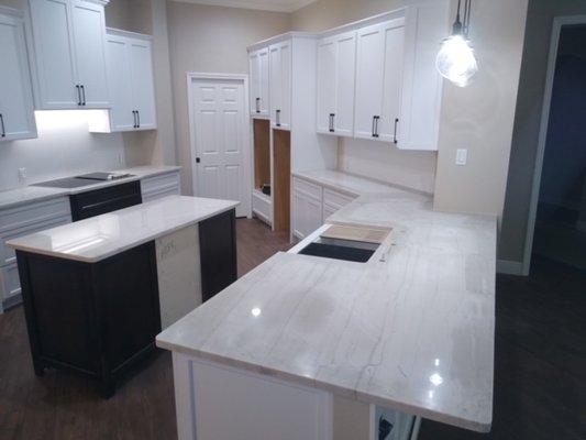 White counters with mixed color cabinets is very popular.