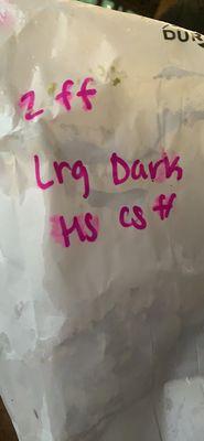 The writing on the bag that claims it was a large dark dinner