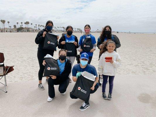 Students volunteering at a beach clean-up.