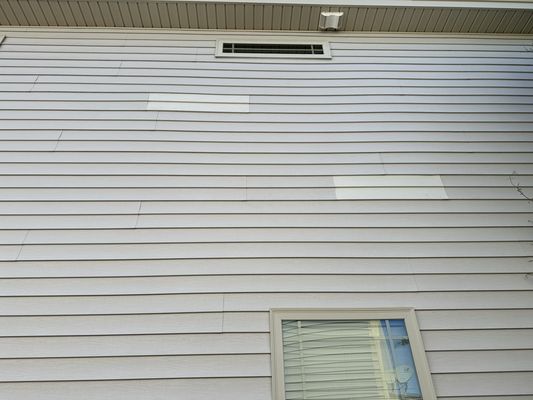 House 1 improper color match and siding replacement. Replace the whole panel!!!