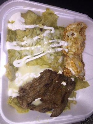 Chilaquiles Verde with fried eggs and beef steak.