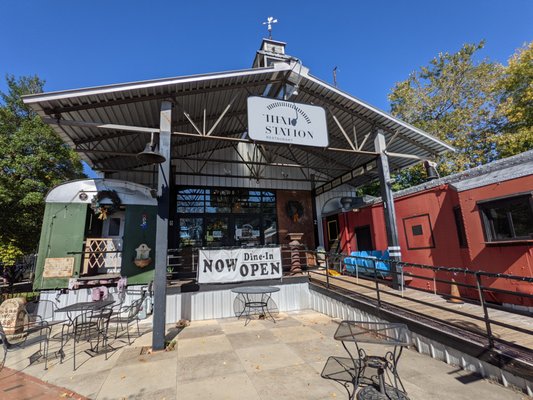 Thai Station restaurant storefront. The restaurant uses old train cars as dining rooms.