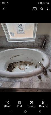 Builder left jetted tub uncovered with all this debris for months.didnt work when house was finished n we moved in