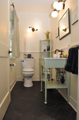 Half Bath with black slate floor and radiant heat.