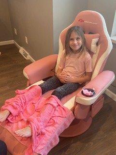 Enjoy a pink lemonade mocktail during your pedicure in a massage chair