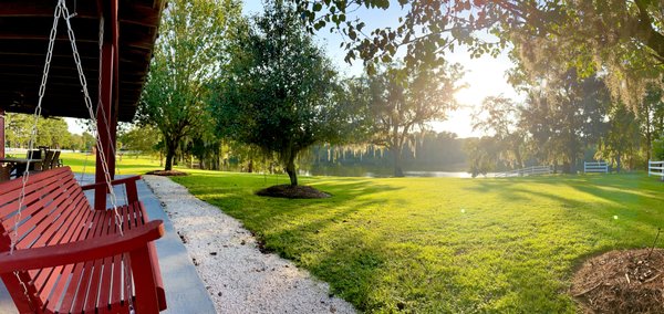 porch swing at the Club House with beautiful lake views. enjoy watching the surise