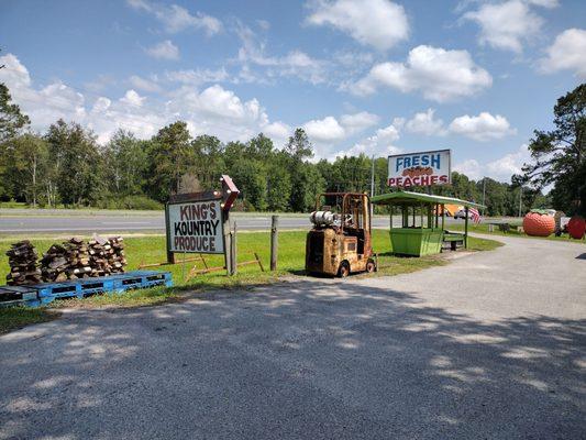 King's Kountry Produce signs and a little teeny mini steamroller.