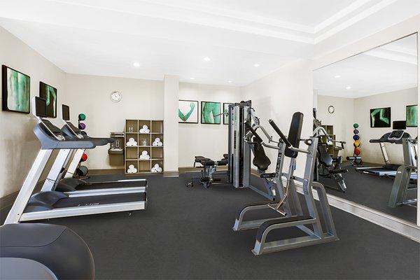 24/7 fitness center with cardio equipment, personal TVs and weight training