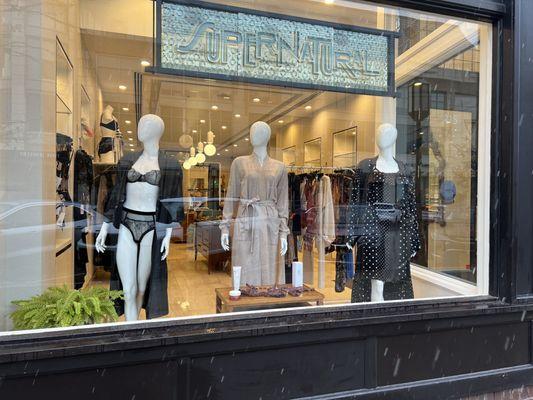 Exterior of Supernatural shop window in Birmingham, MI showing three mannequins in loungewear & lingere