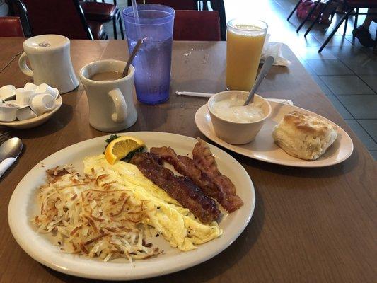 Two eggs scrambled, bacon, hash browns, biscuits and gravy.