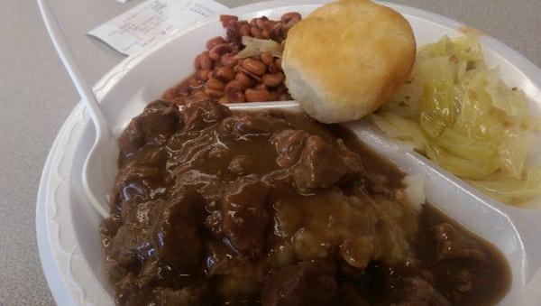 Beef tips on mashed potatoes, field peas, cabbage, and a roll. $5.99, not including tax or drink.