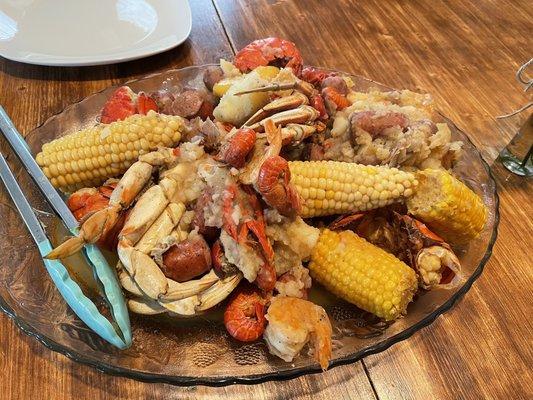 Seafood Boil, Lobster, Shrimp, crab, crawfish, potatoes, corn, andouille sausage.