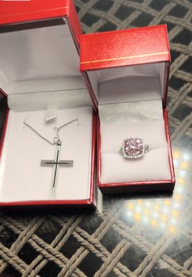 Gorgeous classic cross necklace and pink stone diamond around ring.