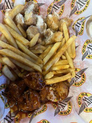 Barbicide and garlic Parmesan boneless wings with fries.