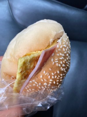 Very pale white rough bread in this ham and cheese bun