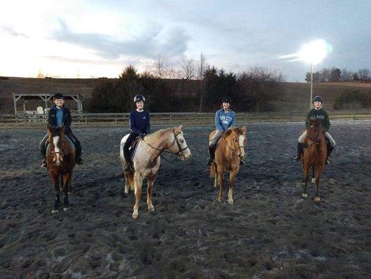 Some happy girls after finishing a fun horseback riding lesson!