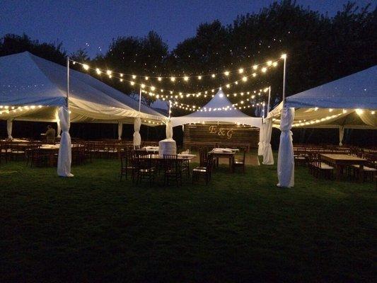 Let us bring your vision to life! Tents and lighting transformed this backyard into a magical wedding.