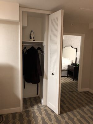 The sitting room closet with complimentary umbrella