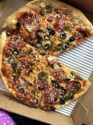 Lunch special pizza with pepperoni, black olives and jalapeños.