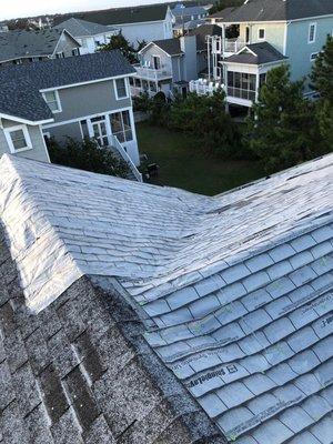 Tarping roof to prevent any further water damage