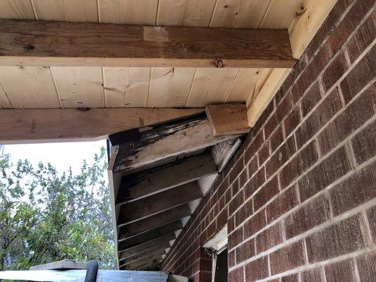 Gap at old porch line. Rotted rafters.