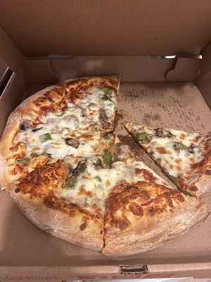 Pizza with spicy sauce, sausage, mushrooms and green peppers