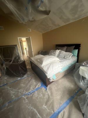 Uncovered bed while removing plaster