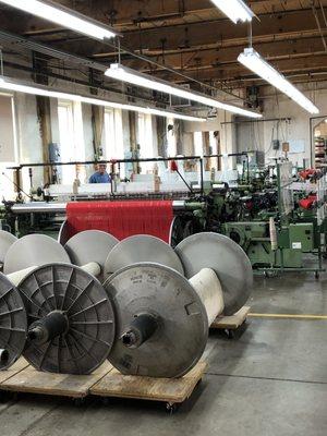 Current day mechanical wool looms running red. Operating today.