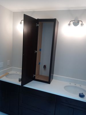 Installed vanity top and a cabinet for storage.