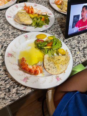 Lobster and soup, steamed veggies sour dough garlic bread