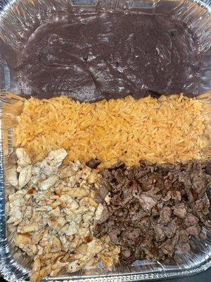 Small tray of rice, refried beans, steak, and chicken