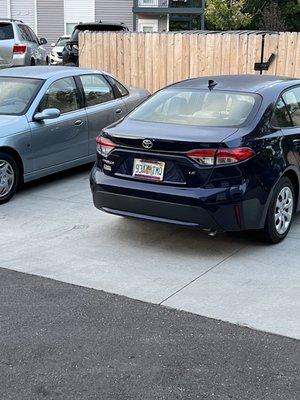 Illegally parked cars due to lack of appropriate number of spaces for residents.