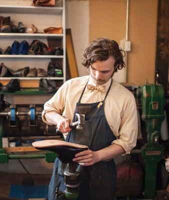 Tim fixing shoes.