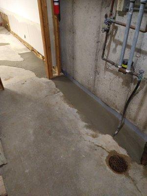 New cement over the drain tile installation