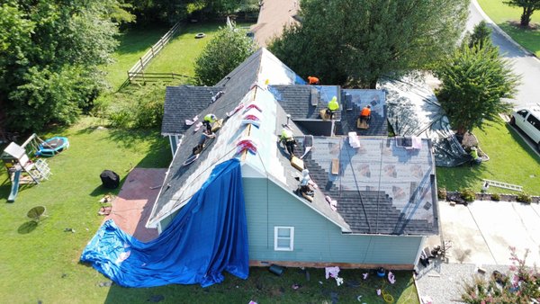 Owens Corning Onyx Black shingle being installed.