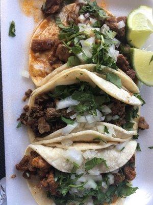 Barbacoa, adovado and asada tacos.